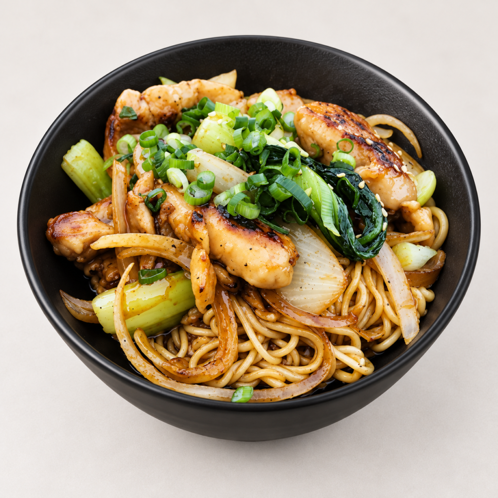 Chicken Ramen Teriyaki with noodles and vegetables in a black bowl on a light background at IN RAMEN