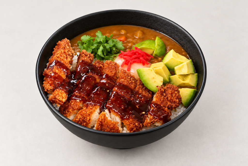 Chicken katsu curry with steamed rice on a light warm gray background at IN RAMEN