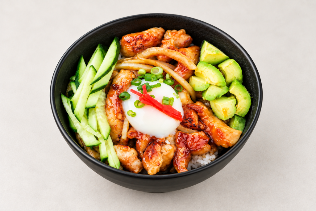 Teriyaki chicken rice bowl on a light warm gray background at IN RAMEN